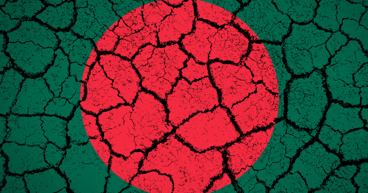 Bangladesh flag painted on cracked ground.