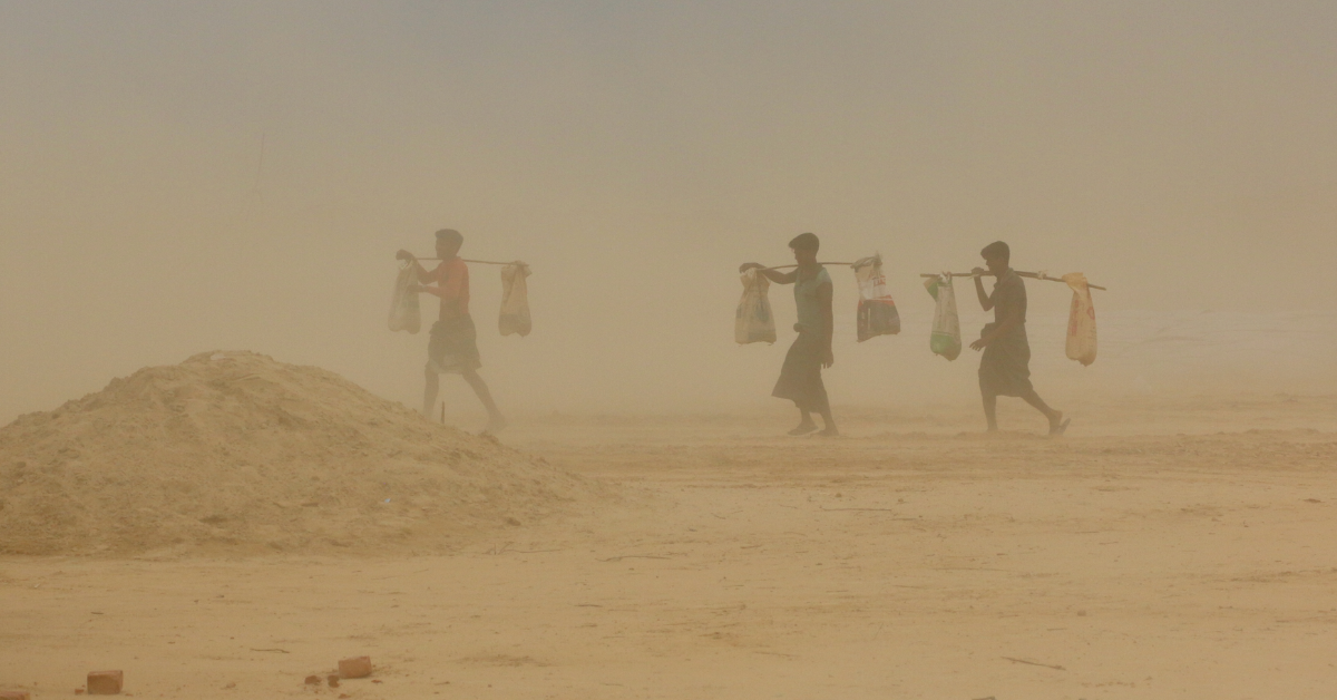 Refugees in Cox's Bazar travelling in a sandstorm